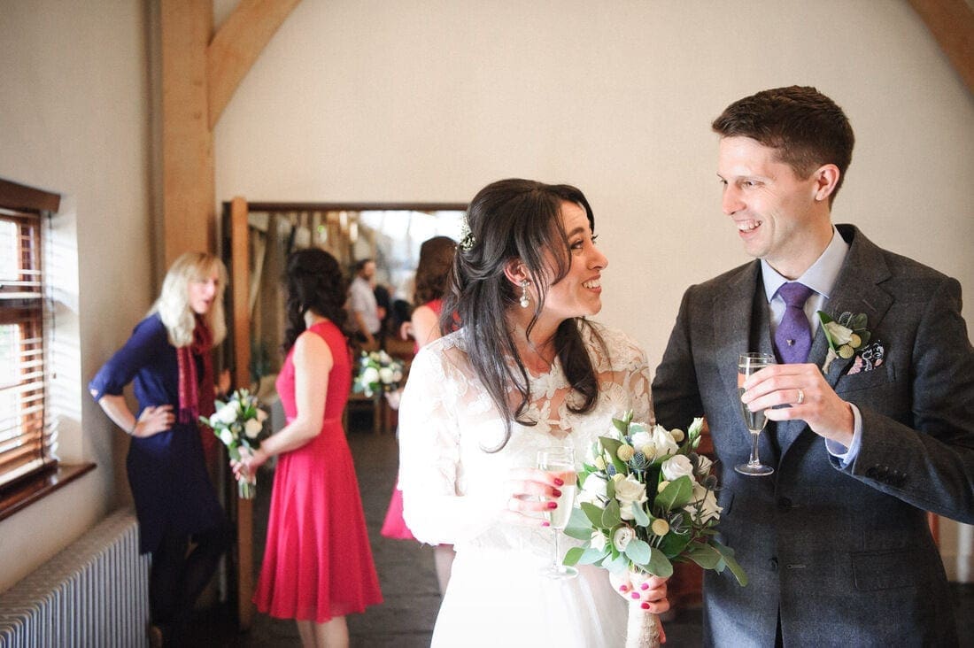 husband and wife enjoy a glass of champagne