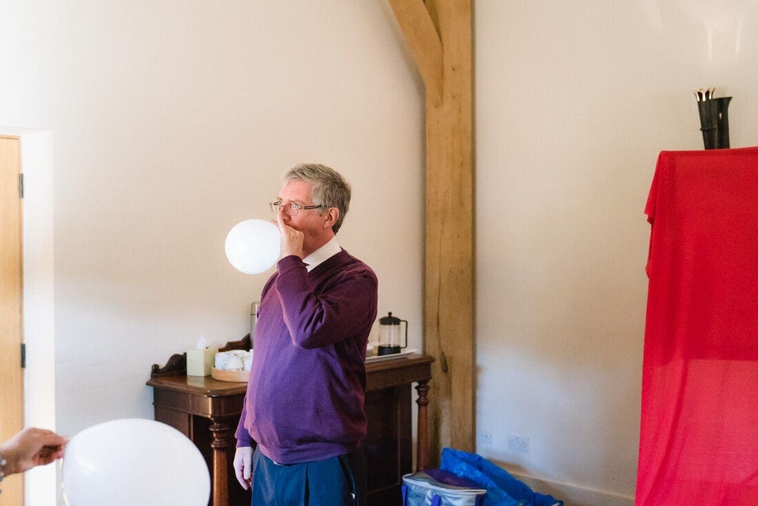 blowing up balloons for the wedding