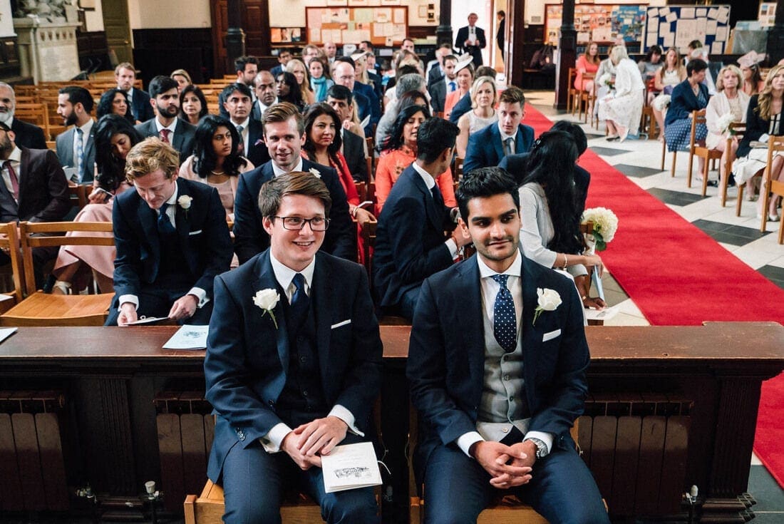 Anish and his best man wait patiently at holy trinity church on Guildford high street