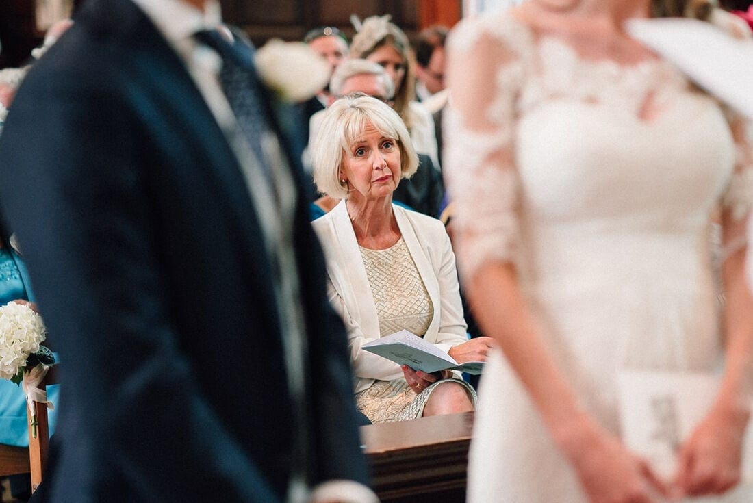 An emotional mum during the wedding ceremony in Surrey