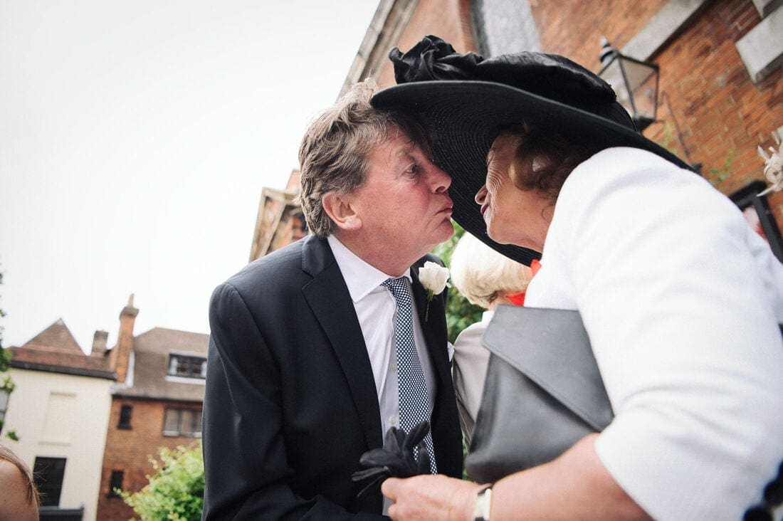 kisses on the steps of Holy Trinity Church on Guildford High Street