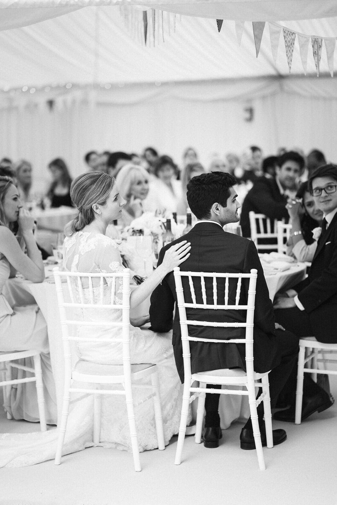 a comforting hand during the wedding speeches