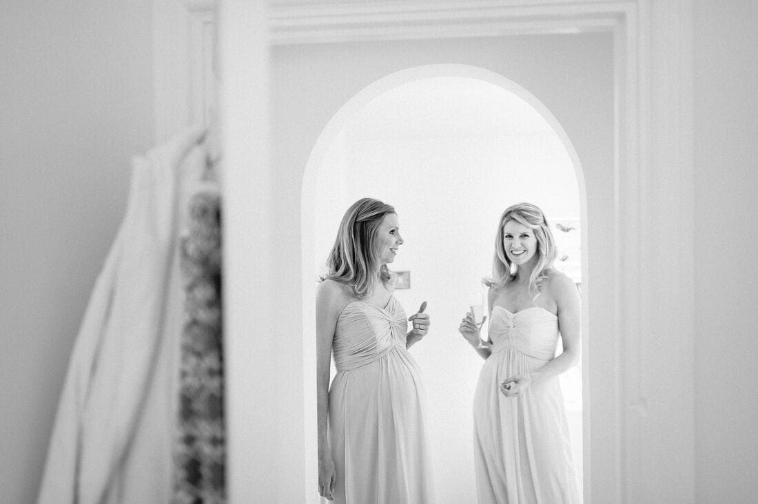 bridesmaids enjoy a drink on the morning of the wedding