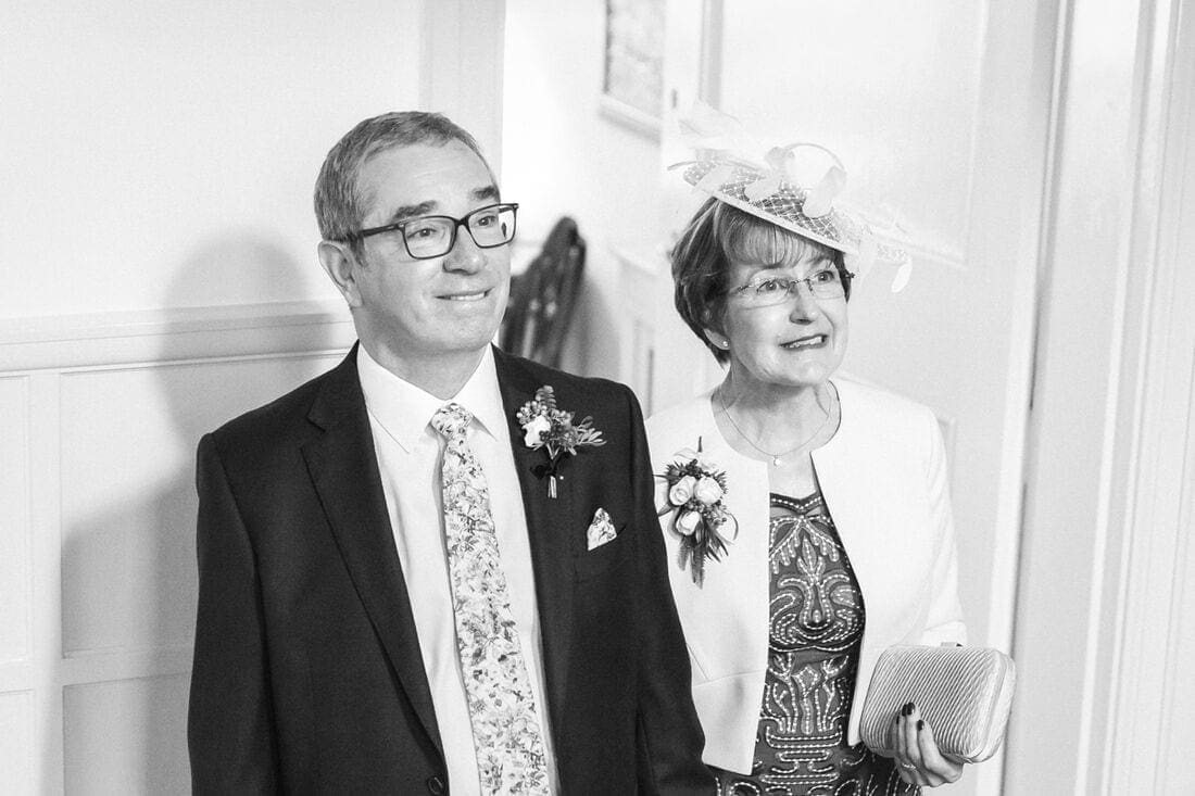 proud mother and father of the bride