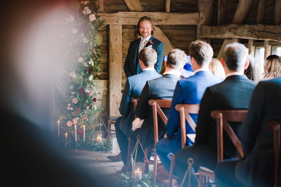 the groom waits for the ceremony to begin