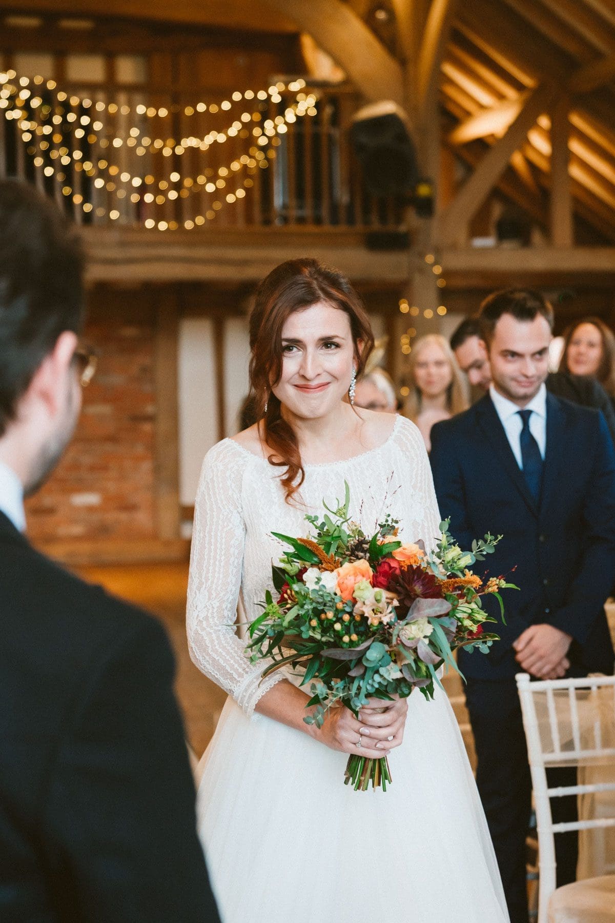 a magic moment caught on camera as the bride enters the wedding ceremony