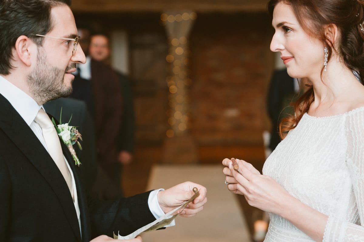 bride and groom read their wedding vows to each other