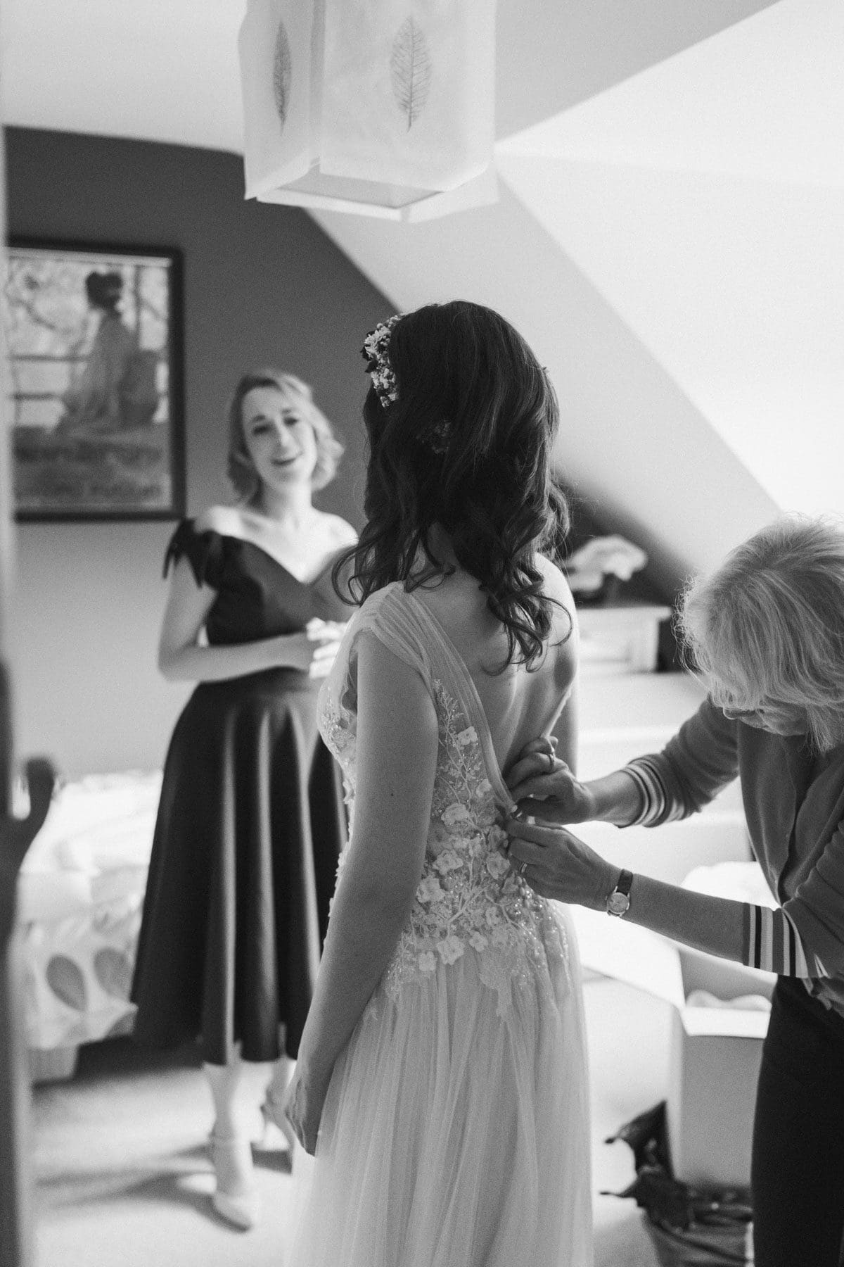 black and white photography of a bride getting ready for her wedding at Elstead Mill